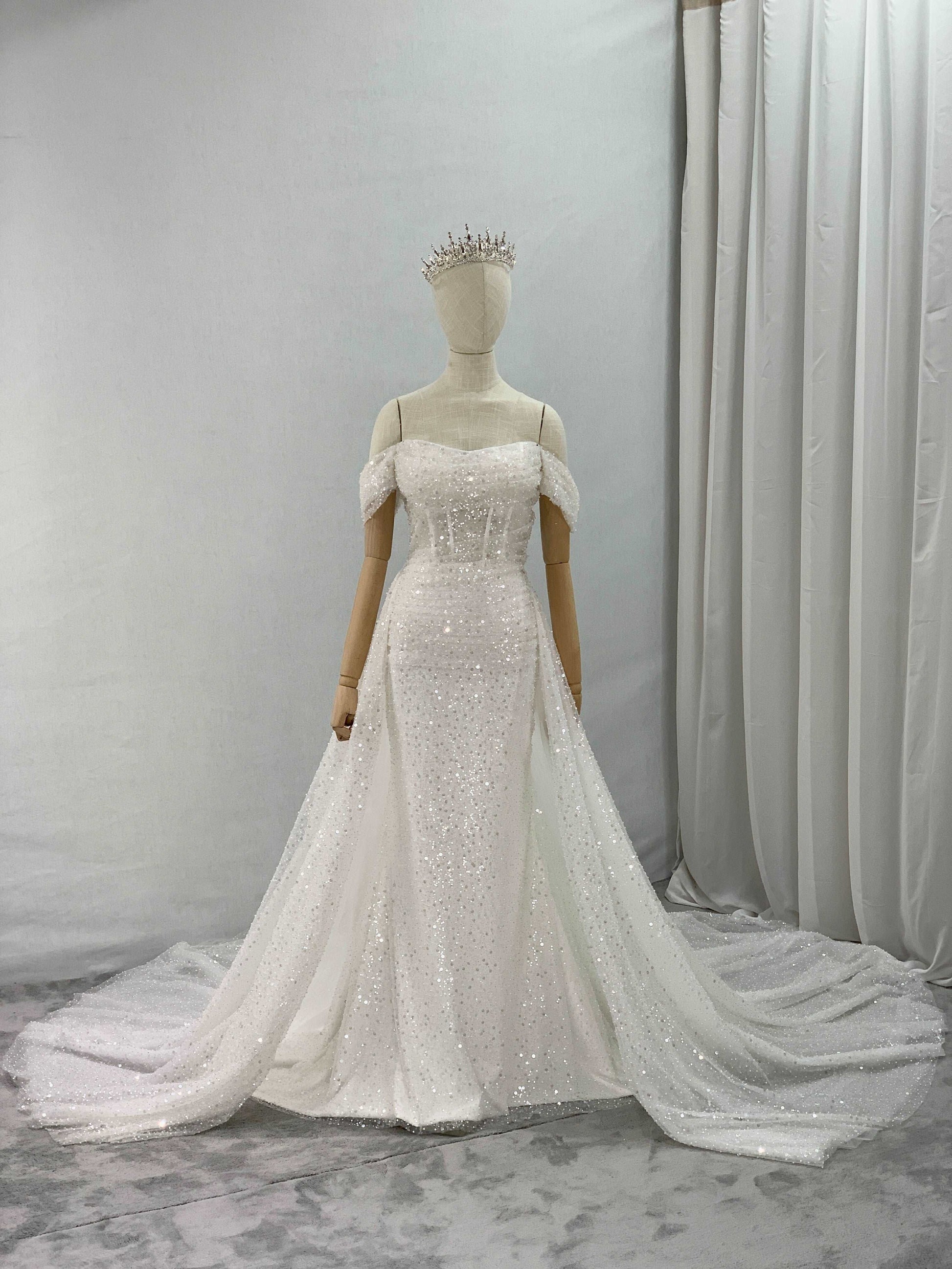 Off Shoulder Sequin Fit & Flare Wedding Dress | Shop A.Cherie Light Ivory / US 8 / Yes Overskirt + Off Shoulder Sequin Fit & Flare Wedding Dress | Shop A.Cherie Light Ivory / US 8 / Yes Overskirt +
